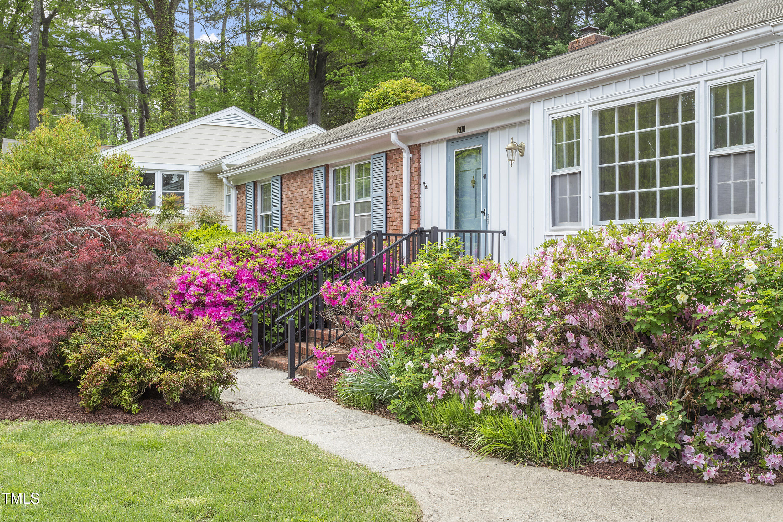 611 Beaver Dam Road Raleigh, NC 27607 - Photo 2 of 36 front view of a house with a yard