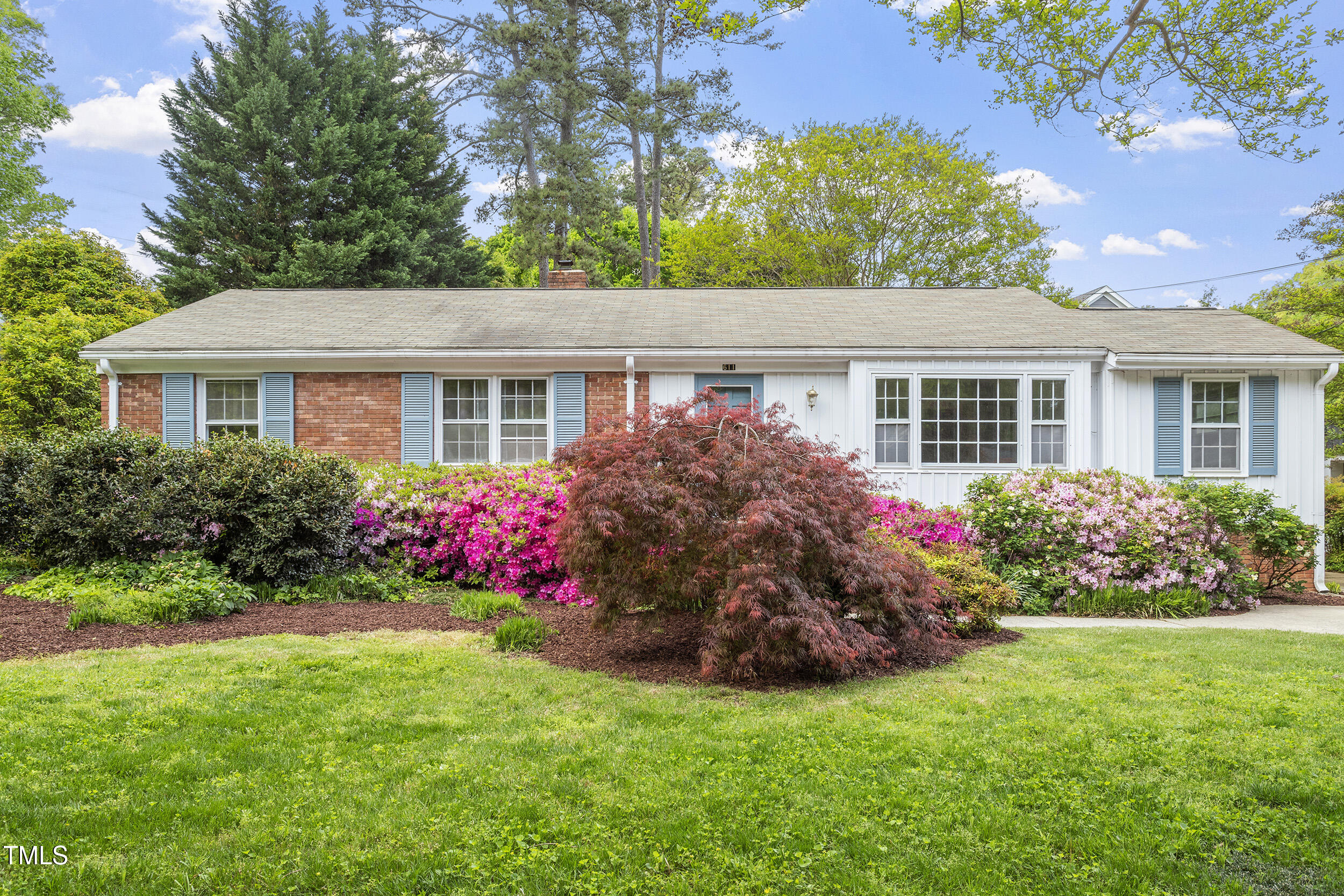 611 Beaver Dam Road Raleigh, NC 27607 - Photo 3 of 36 a view of a house with a big yard and potted plants