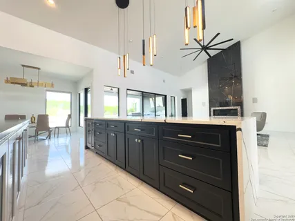 a large spacious bathroom with a double vanity sink a bathtub a mirror and vanity