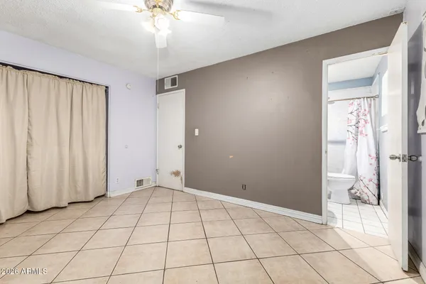 a white toilet sitting next to a bathroom sink