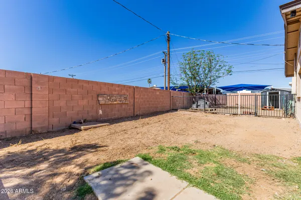 a view of a backyard of the house