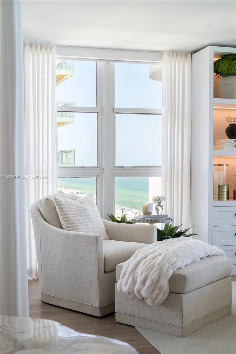 5757 Collins Avenue, Unit 1706 Miami Beach, FL 33140 - Photo 13 of 20 a bedroom with a bed and a large window