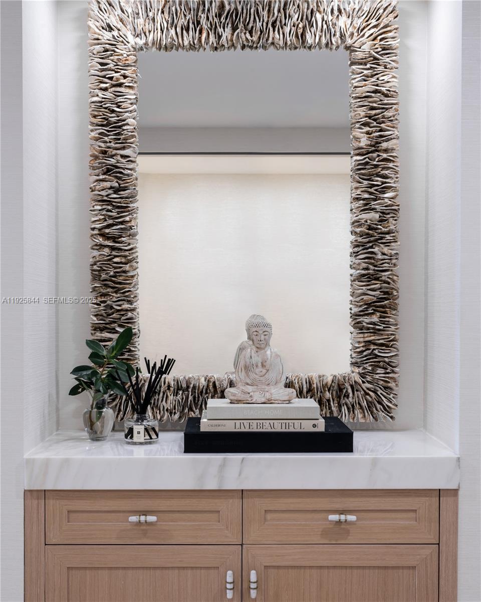 5757 Collins Avenue, Unit 1706 Miami Beach, FL 33140 - Photo 20 of 20 a sink with a potted plant