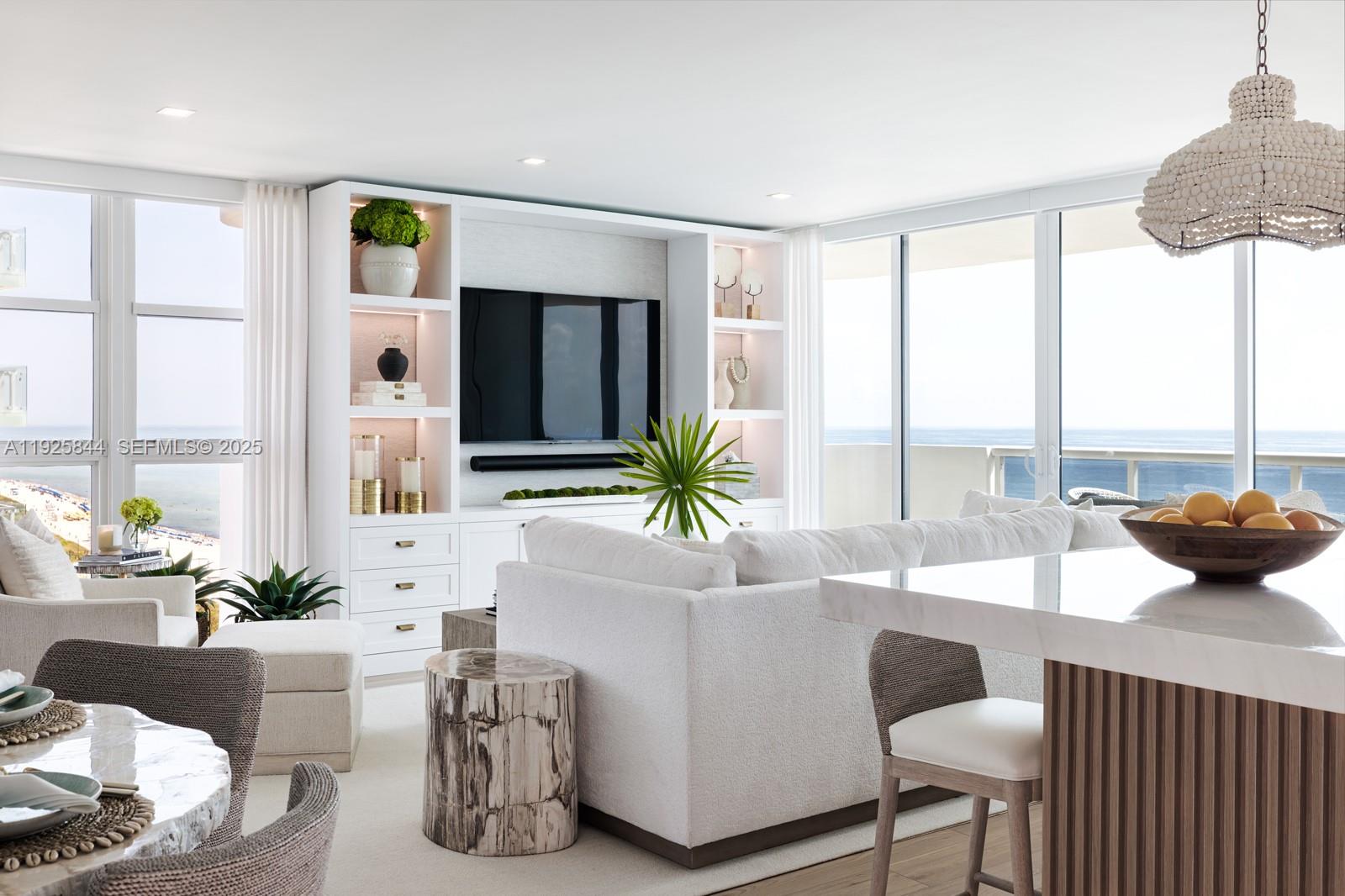 5757 Collins Avenue, Unit 1706 Miami Beach, FL 33140 - Photo 2 of 20 a living room with furniture and a large window