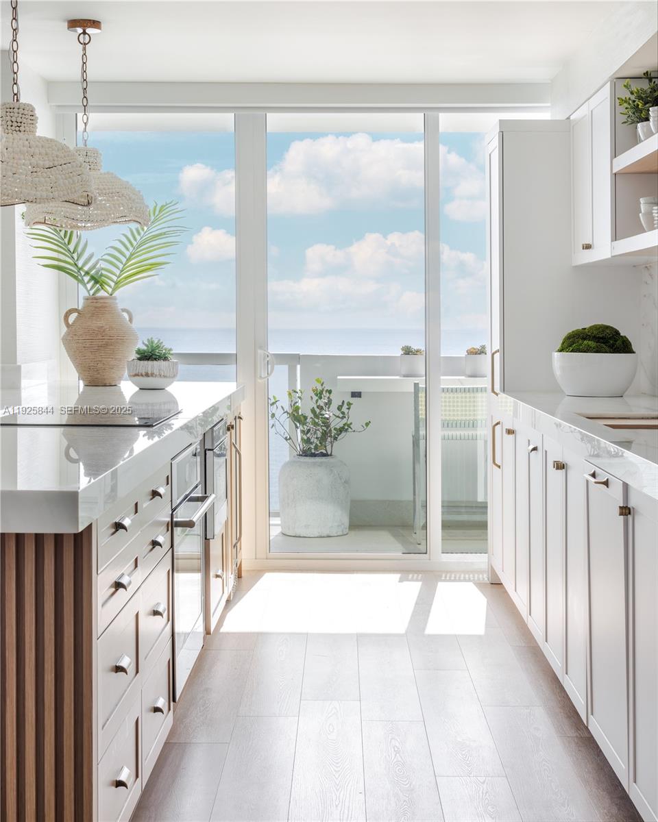 5757 Collins Avenue, Unit 1706 Miami Beach, FL 33140 - Photo 5 of 20 a view of a bathroom with a tub and window