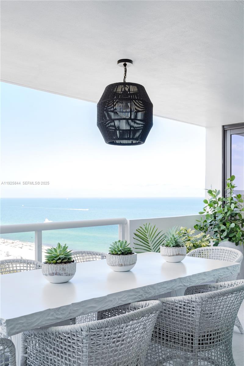 5757 Collins Avenue, Unit 1706 Miami Beach, FL 33140 - Photo 6 of 20 a vase of flowers sitting on a table