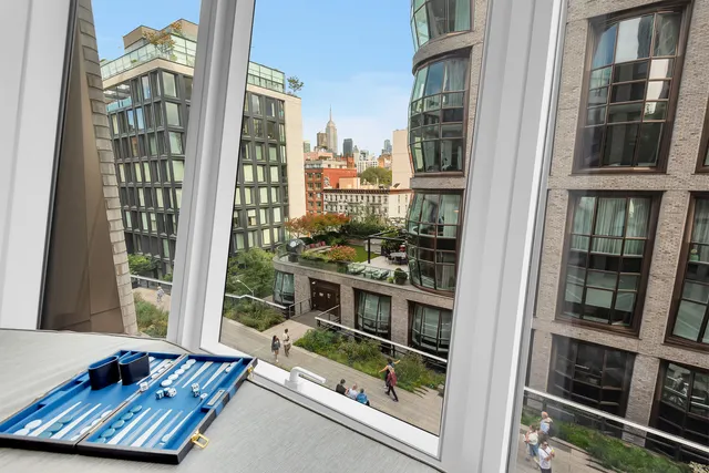 a dining room with furniture and a window