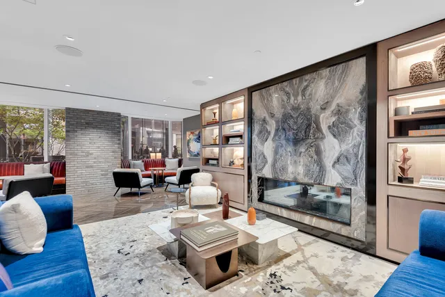 a view of a terrace with furniture and a lake view