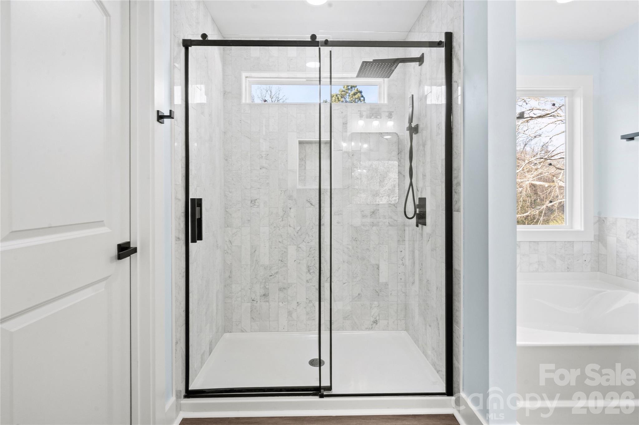 4524 Orphanage Road Concord, NC 28027 - Photo 11 of 29 a bathroom with a glass shower door