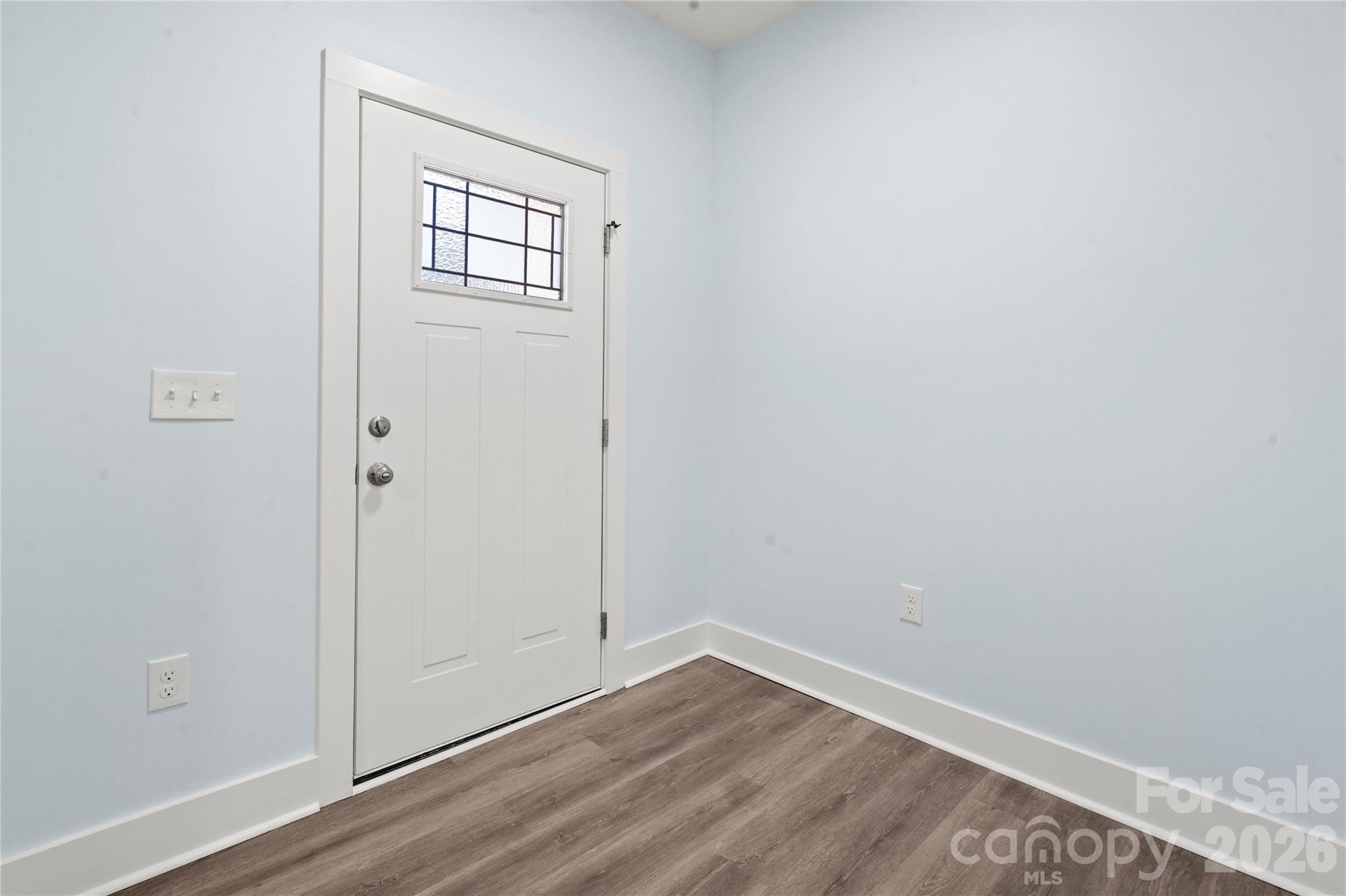 4524 Orphanage Road Concord, NC 28027 - Photo 14 of 29 an empty room with wooden floor and windows