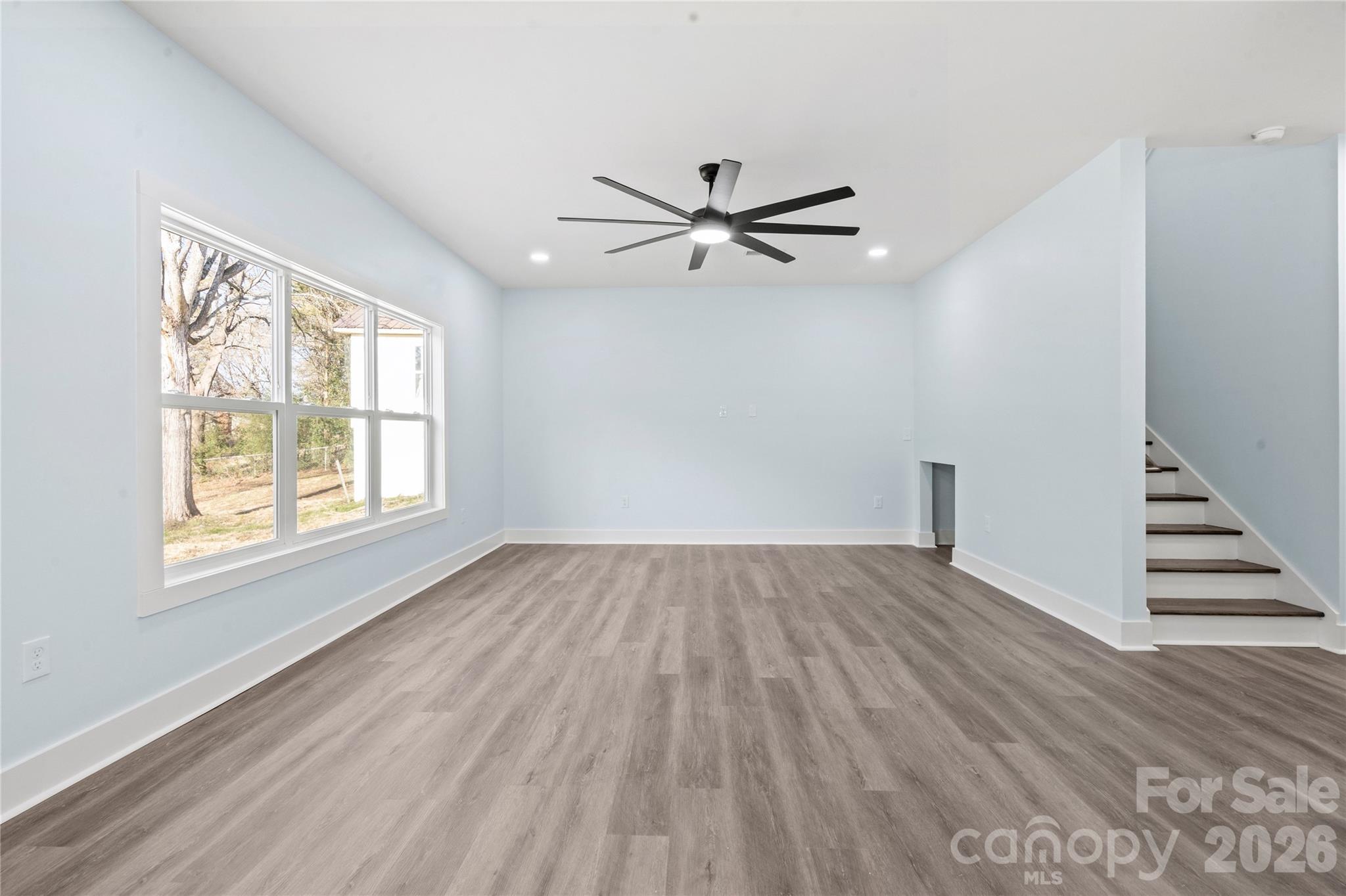 4524 Orphanage Road Concord, NC 28027 - Photo 20 of 29 wooden floor in an empty room with a window