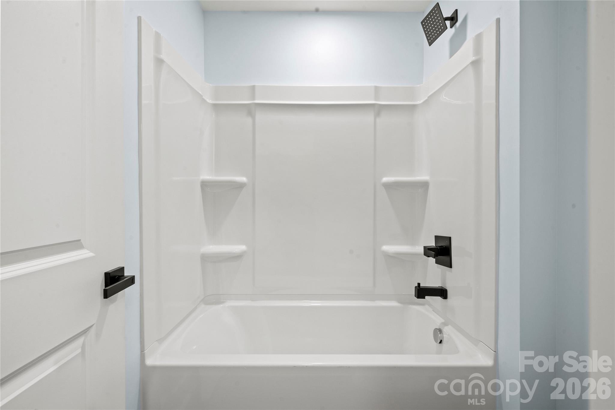4524 Orphanage Road Concord, NC 28027 - Photo 6 of 29 a bathroom with a bathtub and shower