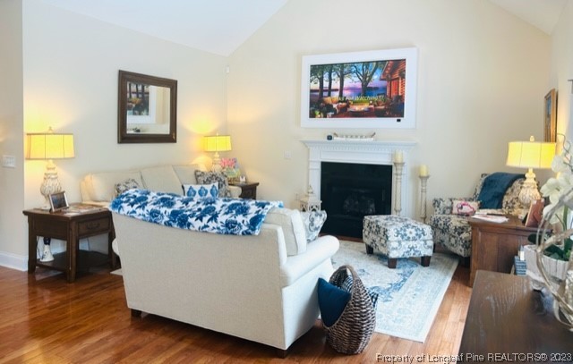 512 Maple Leaf Way Lumberton, NC 28358 - Photo 13 of 27 a living room with furniture a fireplace and a flat screen tv