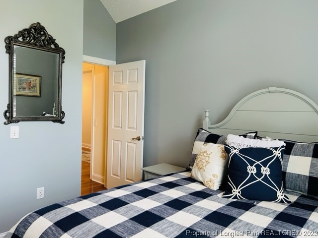 512 Maple Leaf Way Lumberton, NC 28358 - Photo 21 of 27 a bedroom with a bed and a mirror