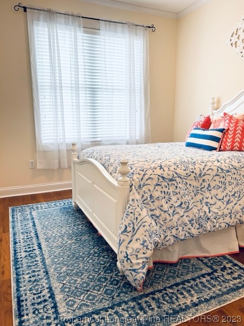 512 Maple Leaf Way Lumberton, NC 28358 - Photo 22 of 27 a bed sitting in a bedroom next to a window