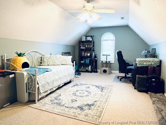 512 Maple Leaf Way Lumberton, NC 28358 - Photo 26 of 27 a bedroom with a bed gym equipment and view of living room