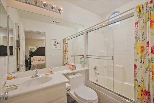a view of washer and dryer with kitchen in the background