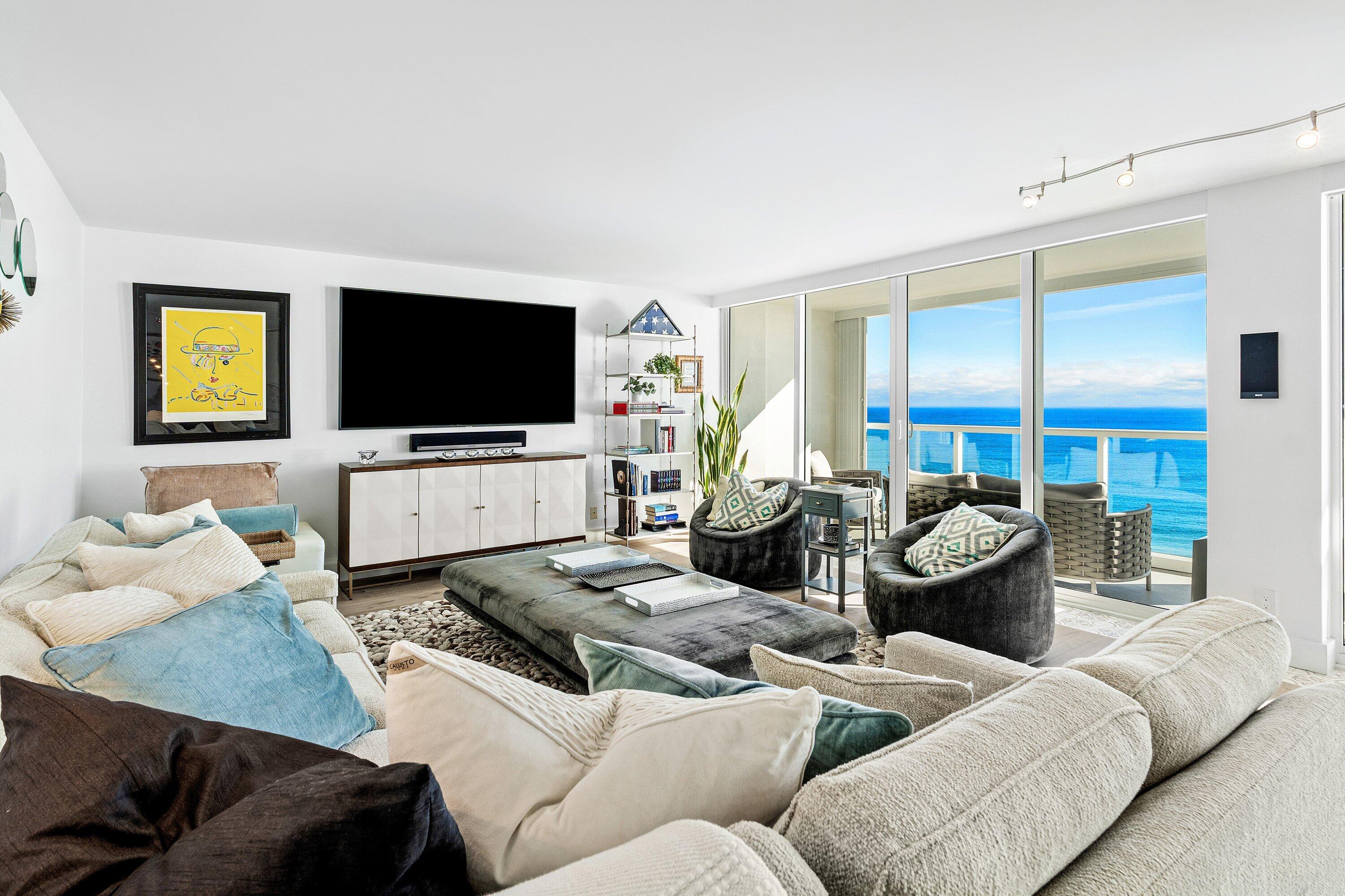 2800 South Ocean Boulevard, Unit LPHC Boca Raton, FL 33432 - Photo 12 of 39 a living room with furniture and a flat screen tv