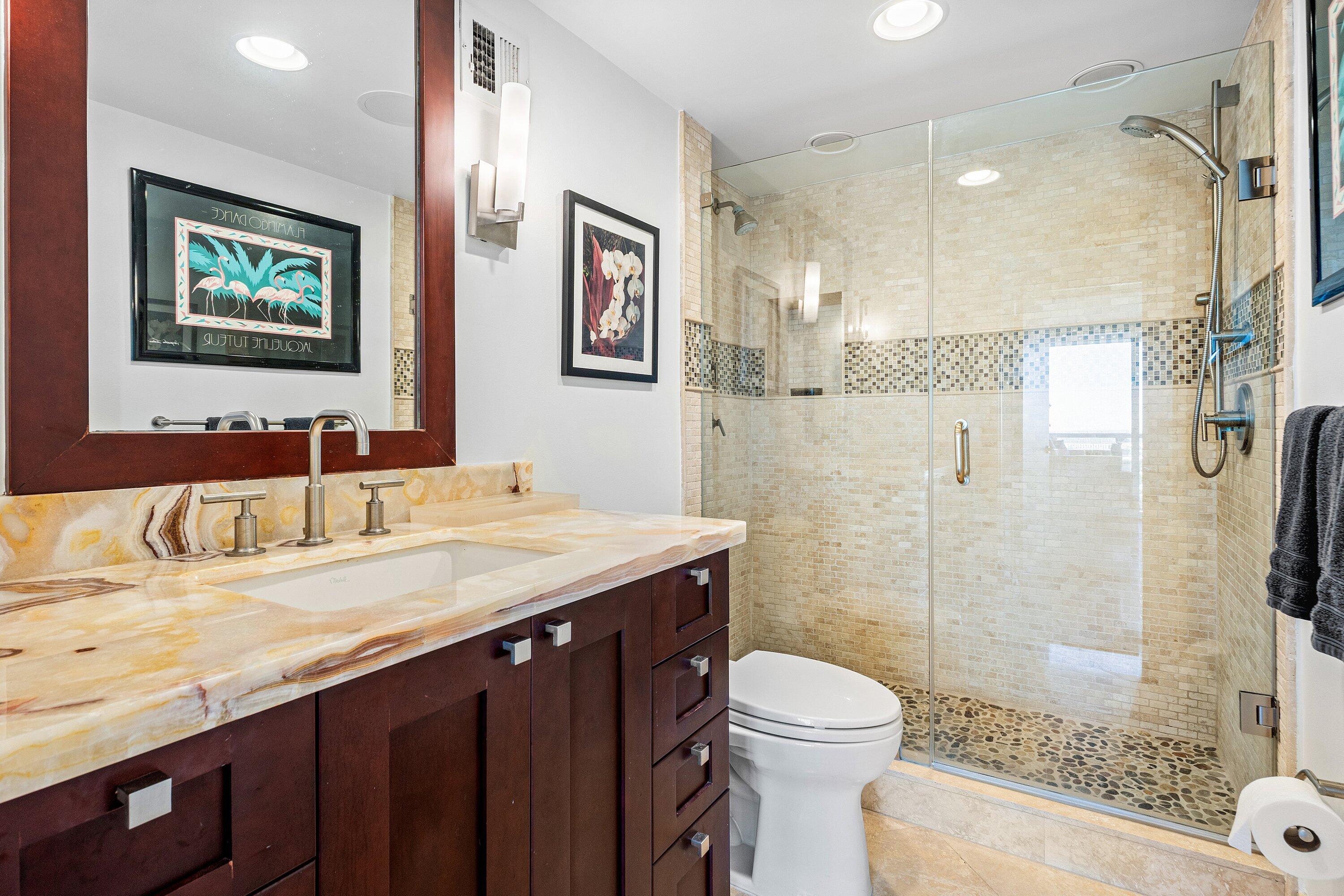 2800 South Ocean Boulevard, Unit LPHC Boca Raton, FL 33432 - Photo 16 of 39 a bathroom with a granite countertop sink toilet and shower