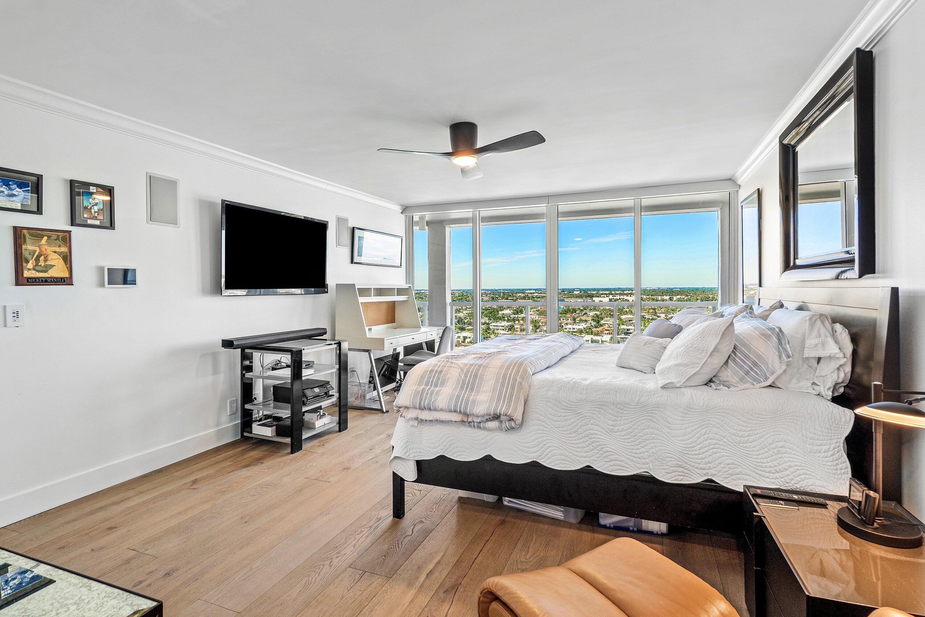 2800 South Ocean Boulevard, Unit LPHC Boca Raton, FL 33432 - Photo 18 of 39 a bedroom with a bed window and a flat screen tv