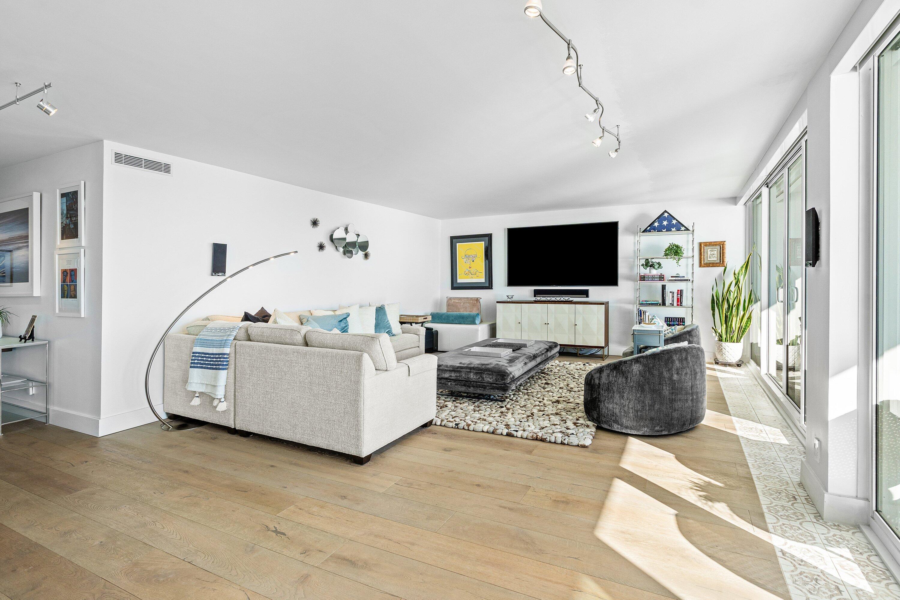 2800 South Ocean Boulevard, Unit LPHC Boca Raton, FL 33432 - Photo 10 of 39 a living room with furniture and a flat screen tv