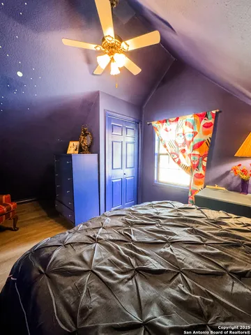 a bed room with a bed and a lamp