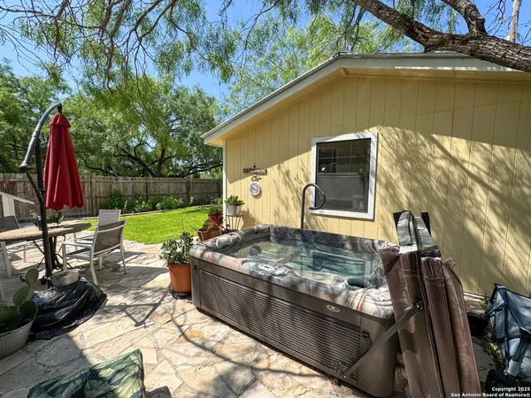 a backyard of a house with lots of green space