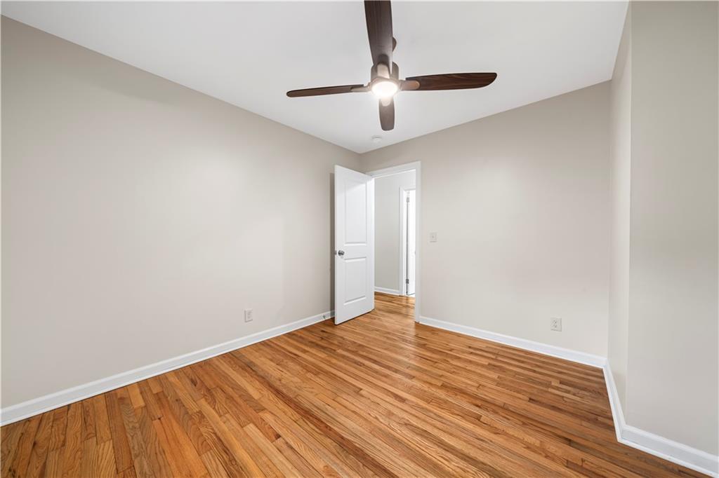 23 East Camelia Road Northeast Rome, GA 30161 - Photo 14 of 27 a view of an empty room with wooden floor