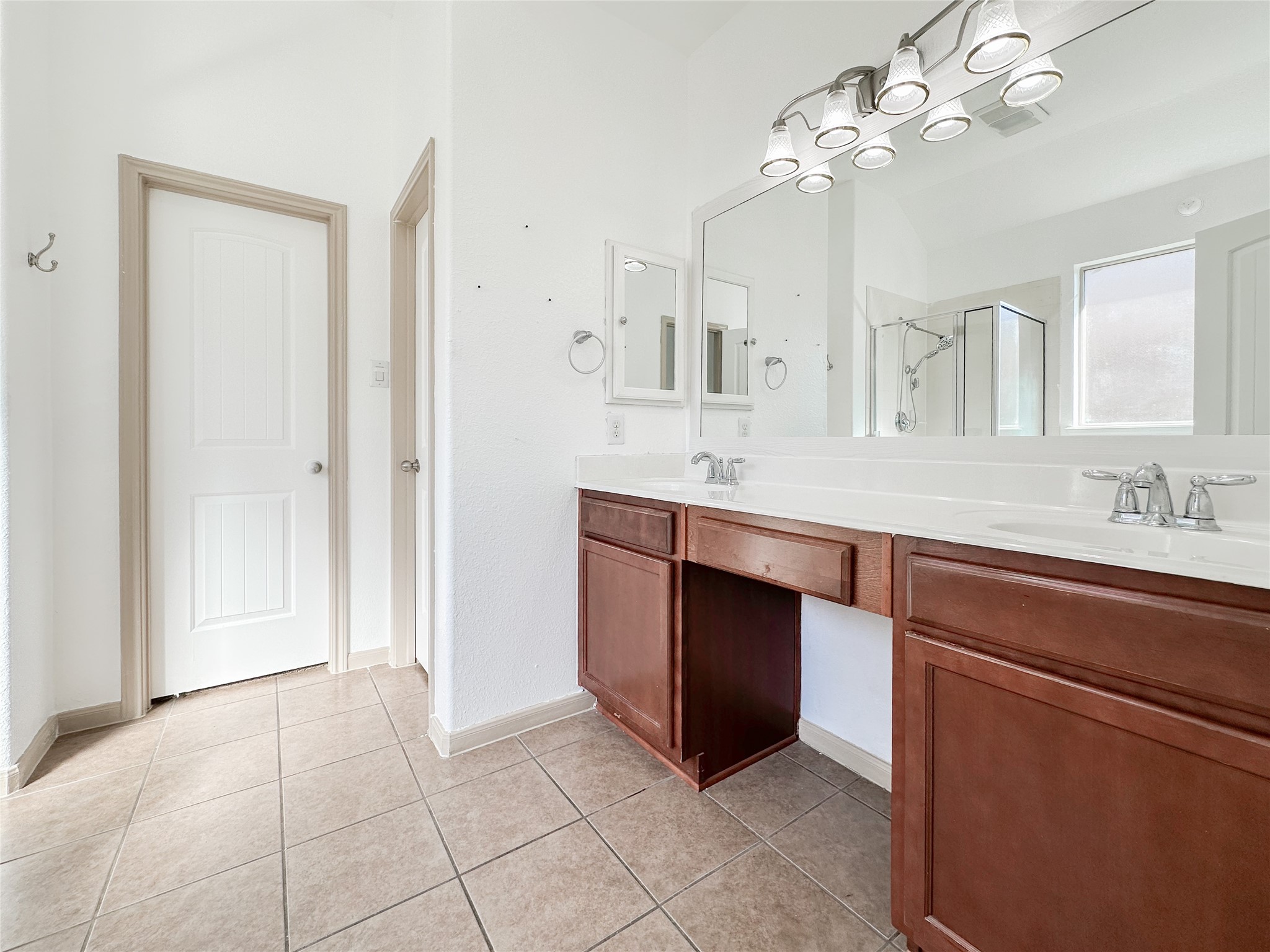 20319 Little Wing Drive Spring, TX 77388 - Photo 32 of 49 a spacious bathroom with a granite countertop sink a mirror and a vanity