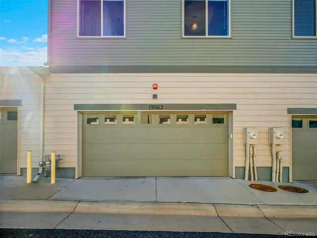 a front view of a building with garage