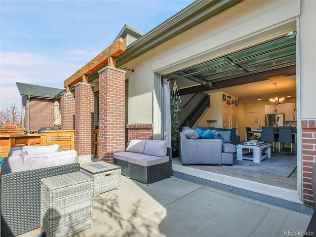 a view of living room filled with furniture and a potted plant