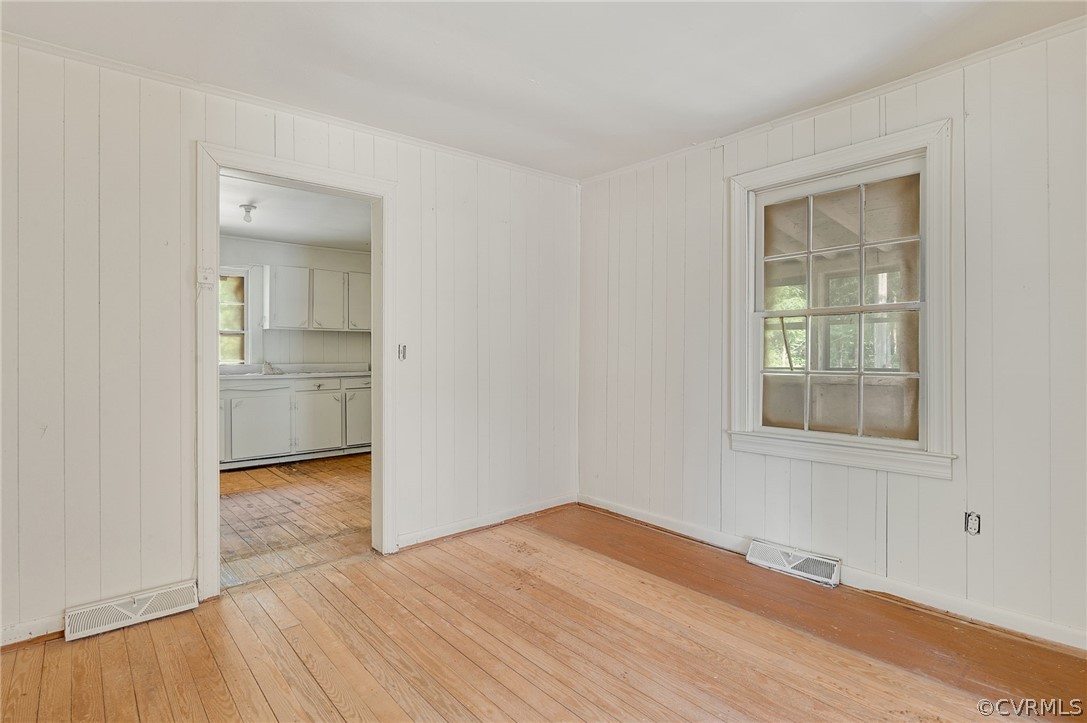 12313 Spiceley Road Ford, VA 23850 - Photo 5 of 17 a view of empty room with wooden floor and fan