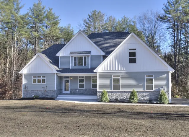 front view of a house with a yard