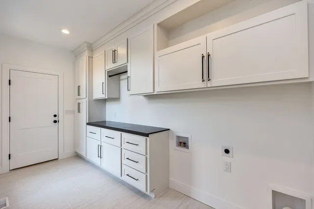 a kitchen with stainless steel appliances granite countertop a sink and a stove