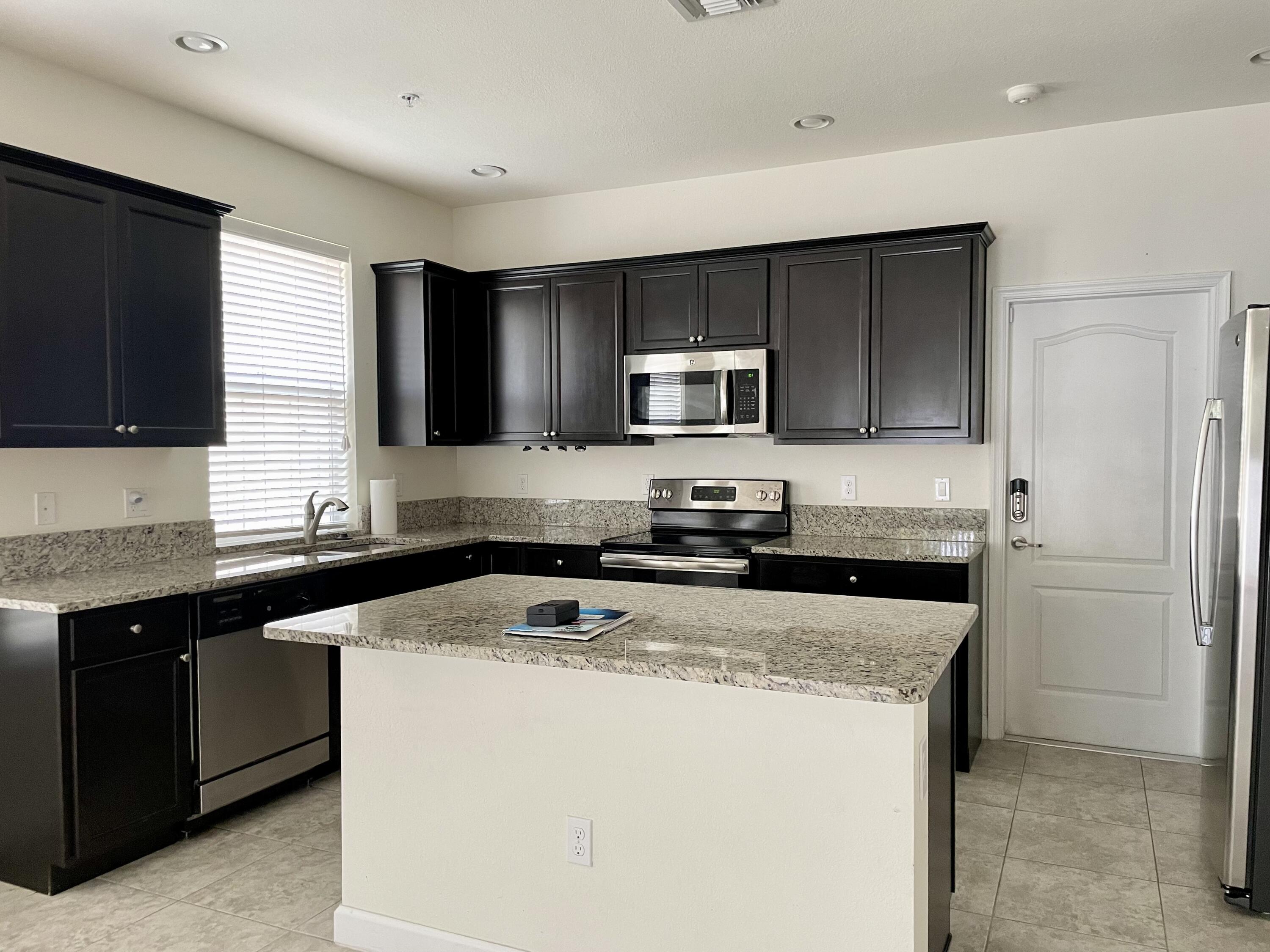 9626 Southwest Purple Martin Way Stuart, FL 34997 - Photo 25 of 48 lg open kitchen