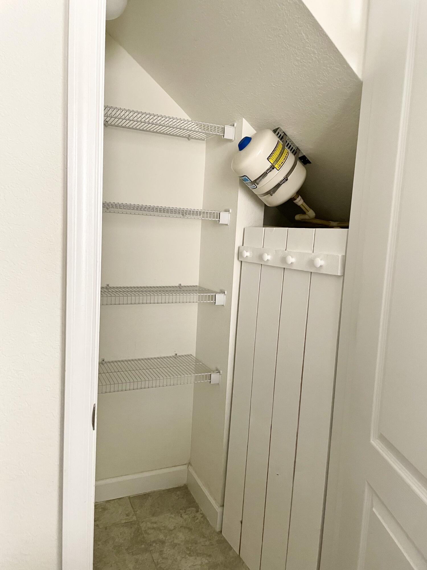 9626 Southwest Purple Martin Way Stuart, FL 34997 - Photo 30 of 48 pantry and water heater