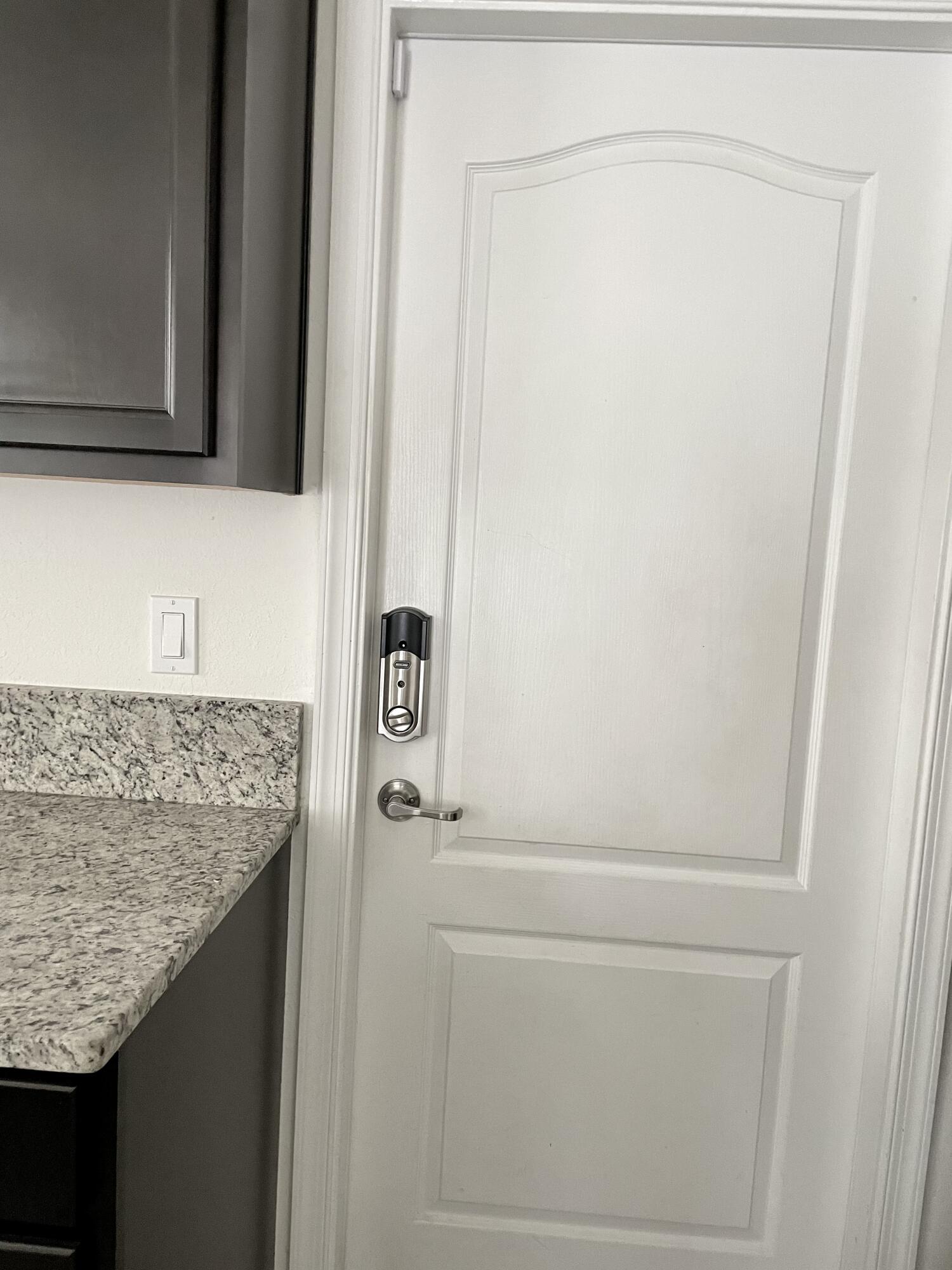 9626 Southwest Purple Martin Way Stuart, FL 34997 - Photo 31 of 48 Schlage lock on door to garage