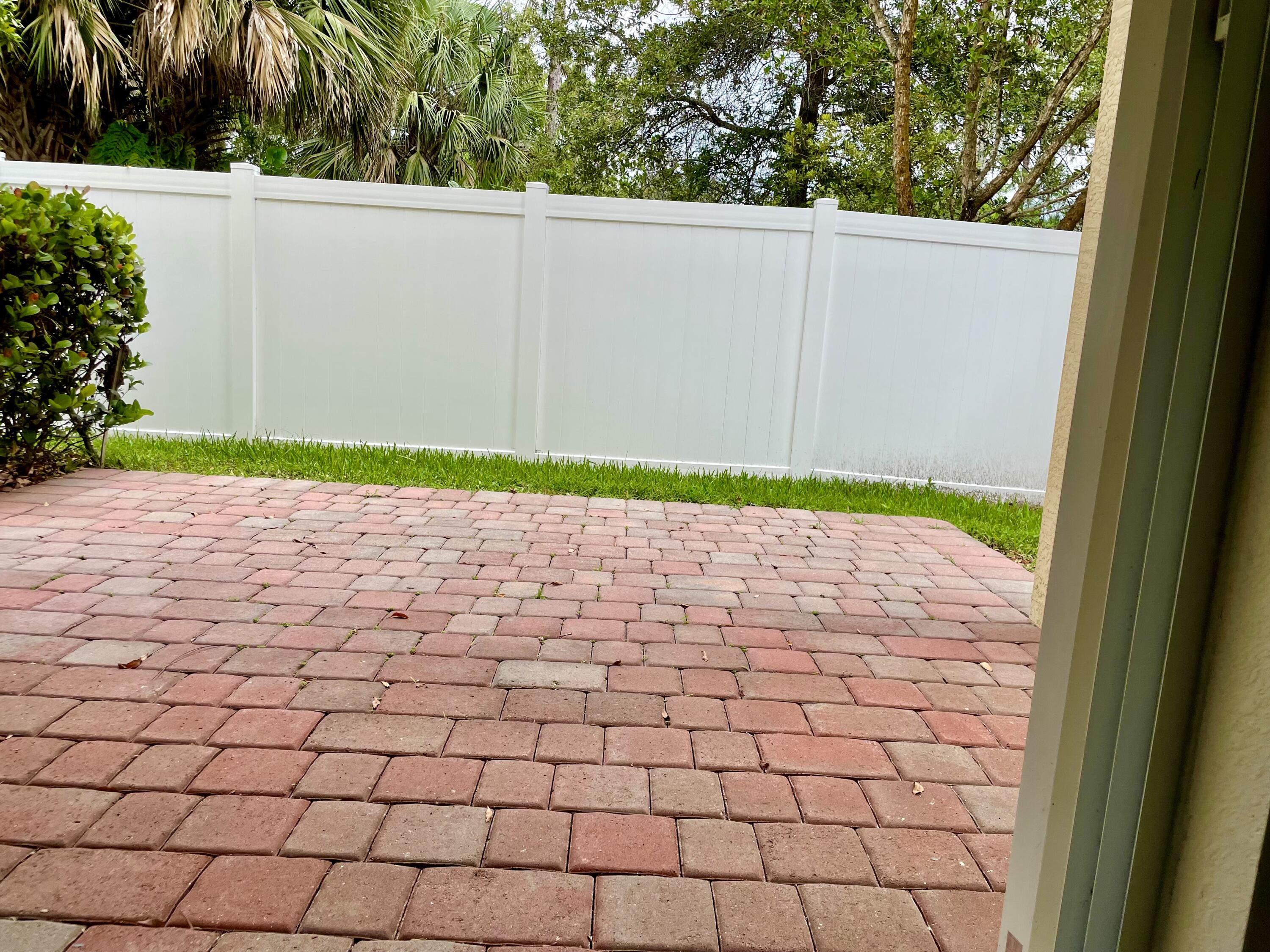 9626 Southwest Purple Martin Way Stuart, FL 34997 - Photo 34 of 48 Backyard with Patio Pavers