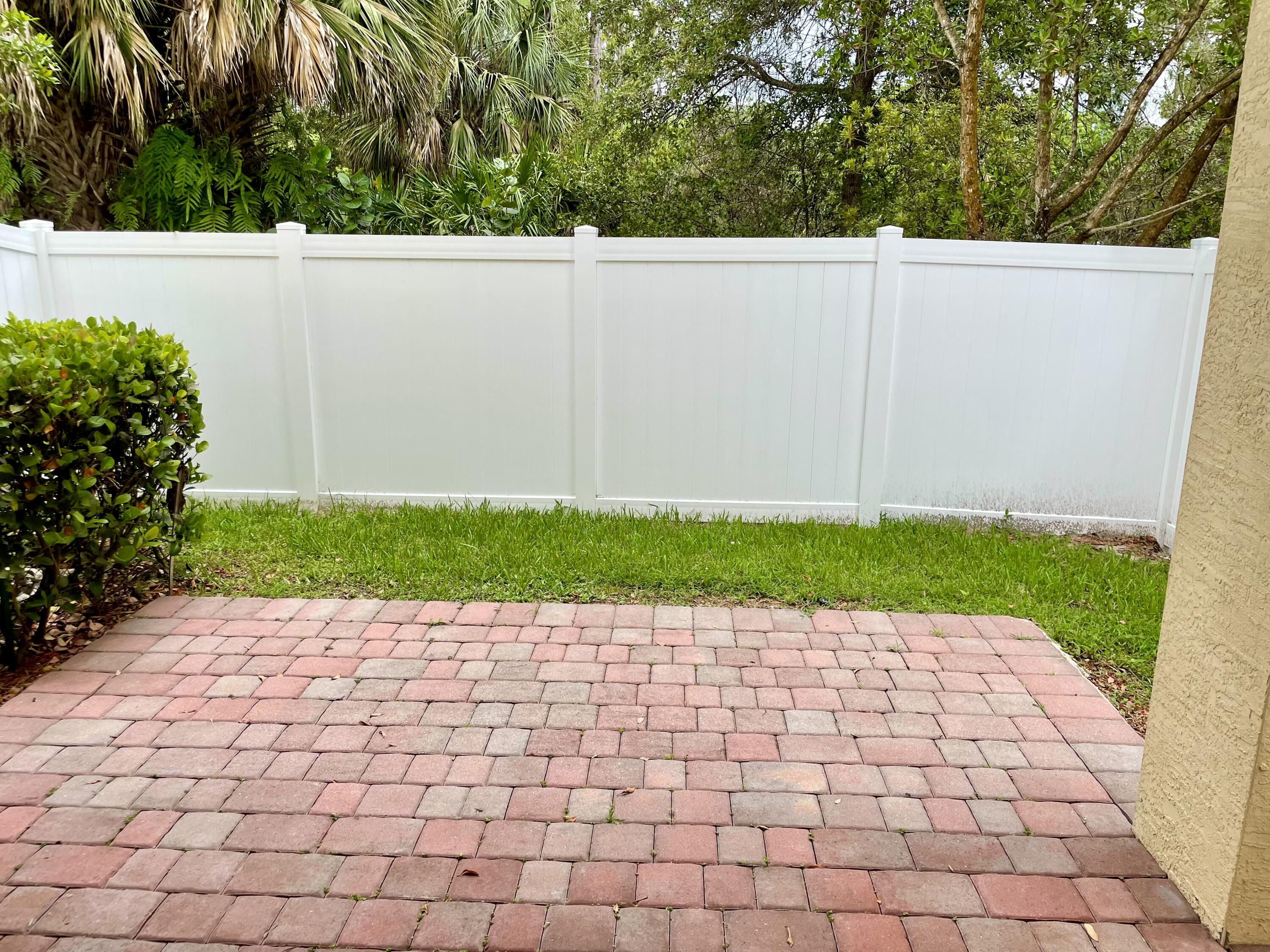 9626 Southwest Purple Martin Way Stuart, FL 34997 - Photo 35 of 48 Backyard with green grass area for Dogs