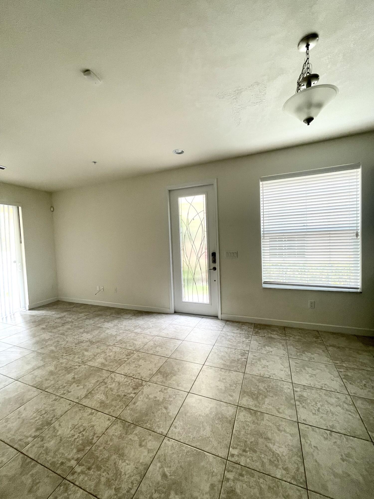 9626 Southwest Purple Martin Way Stuart, FL 34997 - Photo 38 of 48 large windows in living area