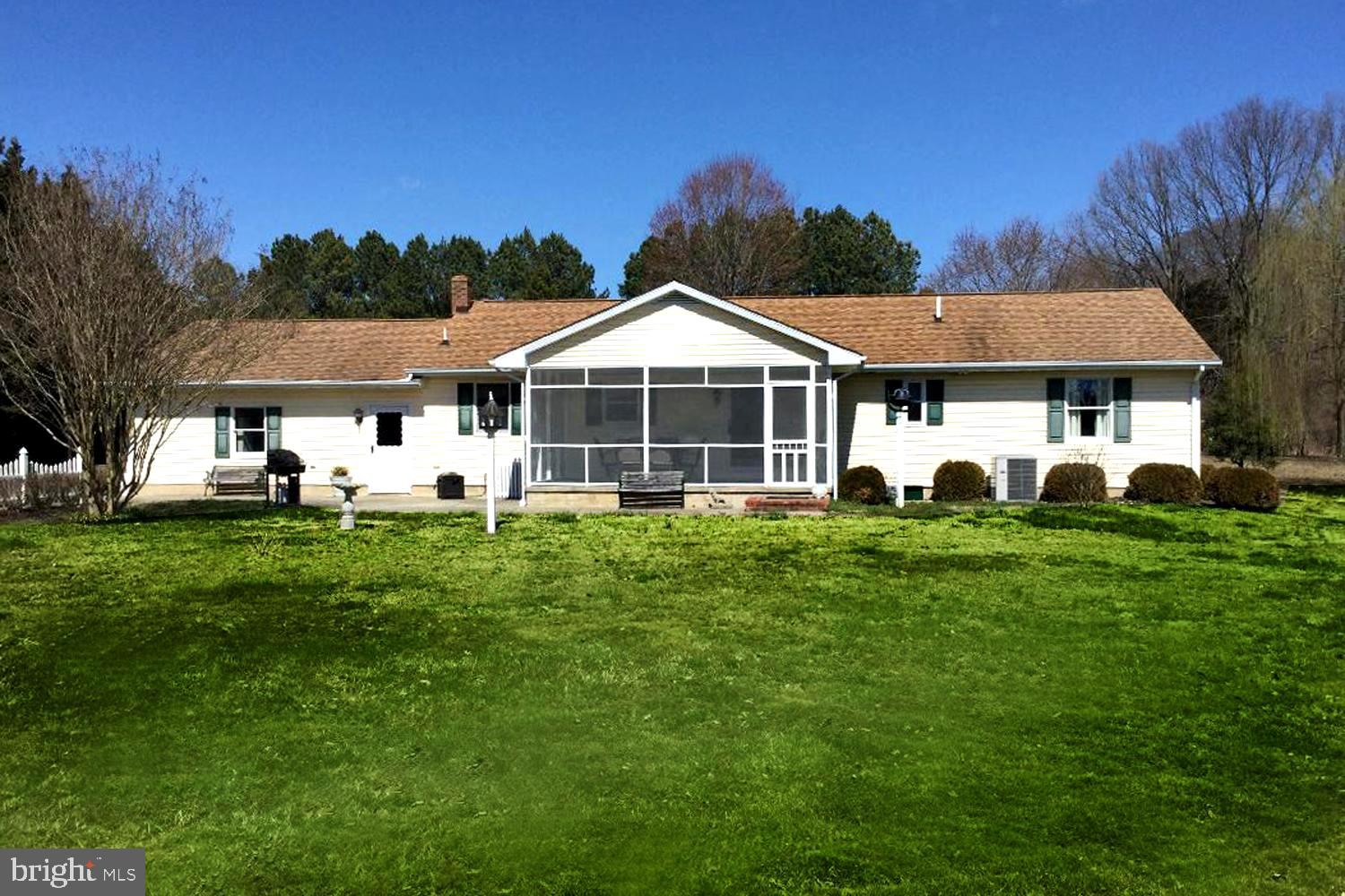 206 Cove Road Queenstown, MD 21658 - Photo 2 of 29 Screened Porch Overseeing Sprawling Lawn