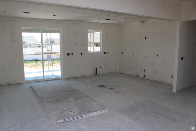 4933 East Remington Road Cedar City, UT 84721 - Photo 9 of 33 Spacious interior room with concrete flooring and prepped drywall surfaces