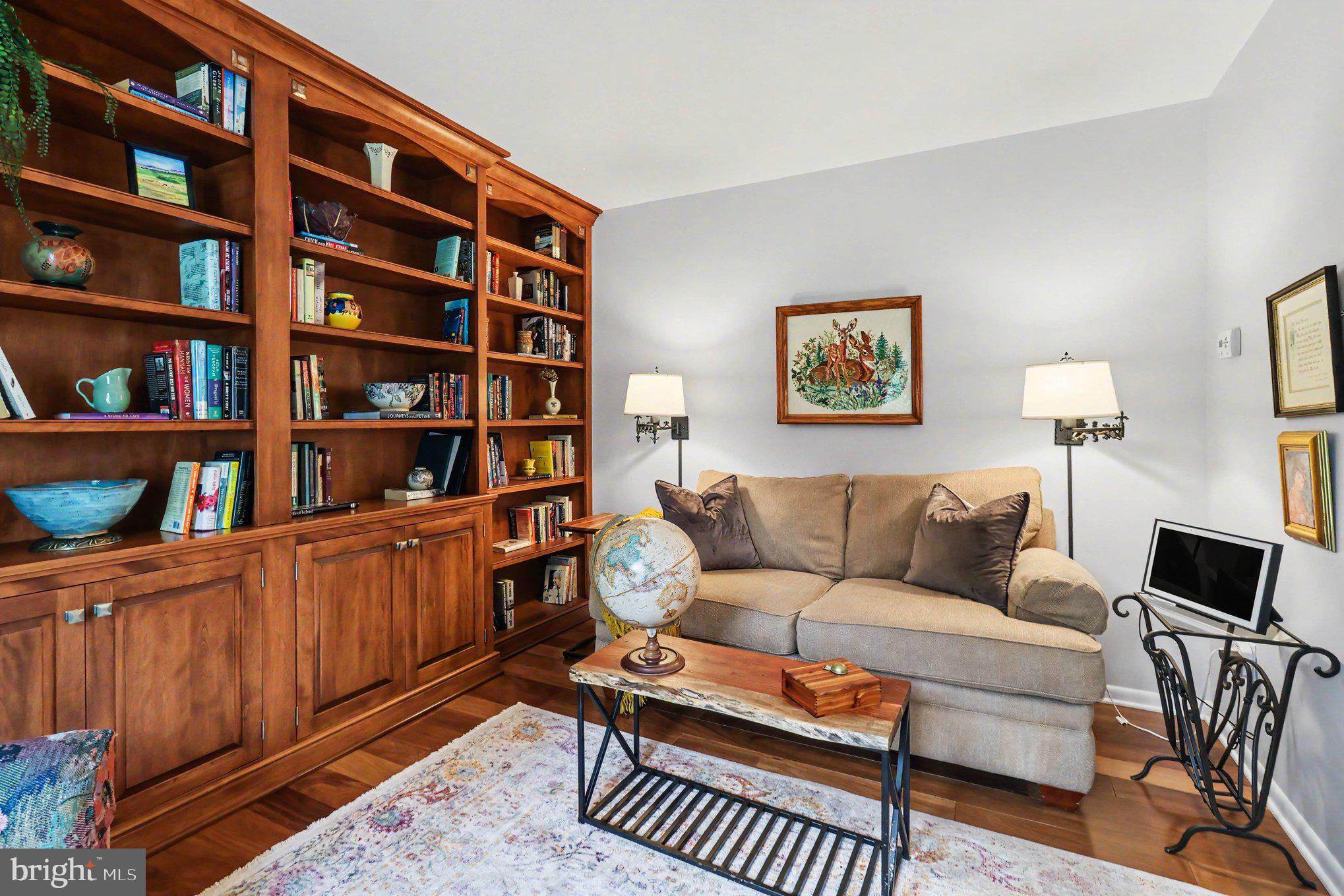 25 East Knowlton Road Media, PA 19063 - Photo 9 of 73 a living room with furniture and a book shelf