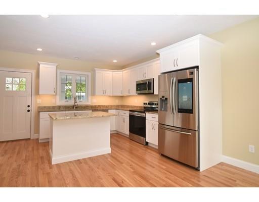 4 Crump Road Bourne, MA 02532 - Photo 9 of 28 a kitchen with a refrigerator cabinets and wooden floor