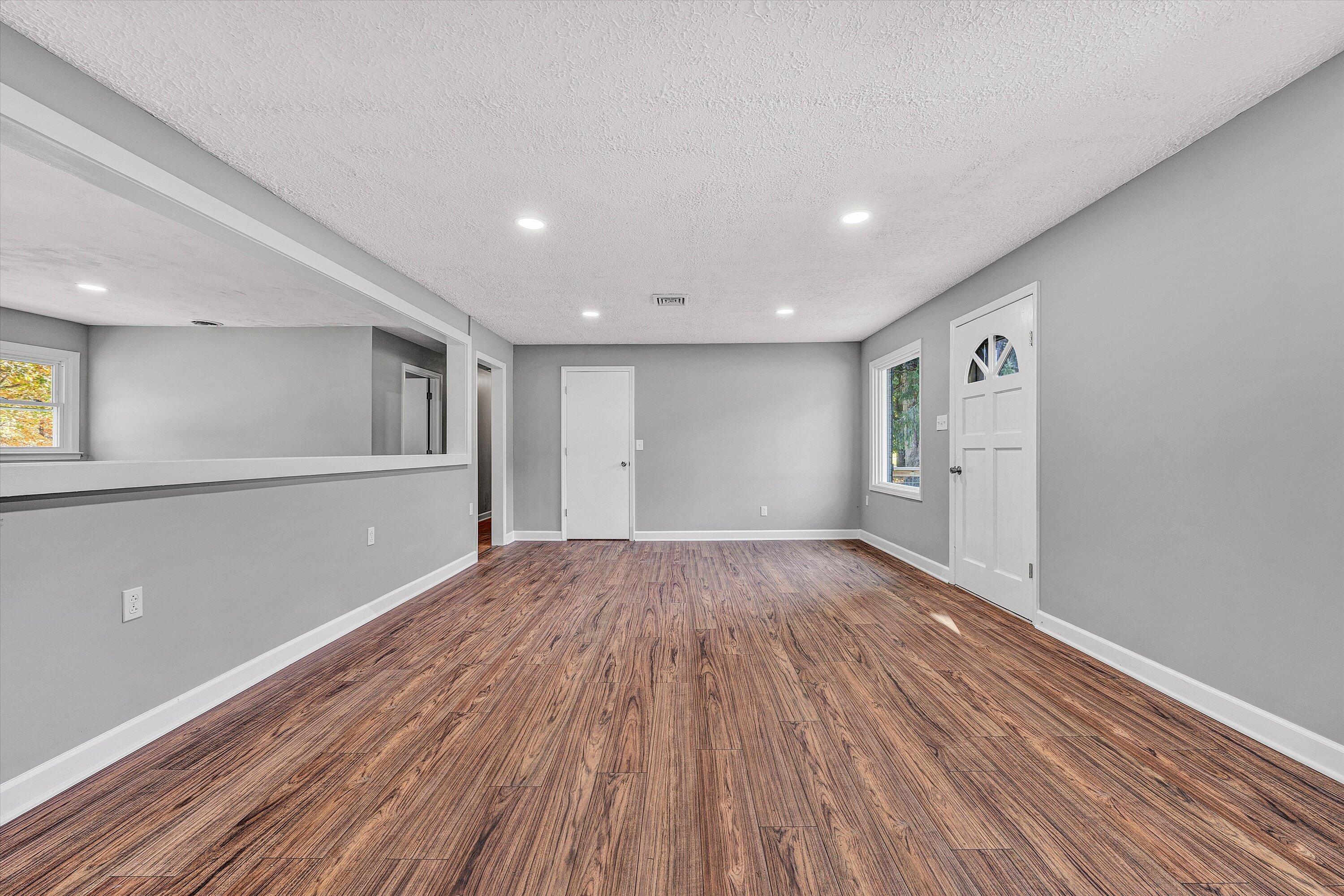 304 Broken Arrow Lane Covington, VA 24426 - Photo 11 of 46 a view of empty room with wooden floor