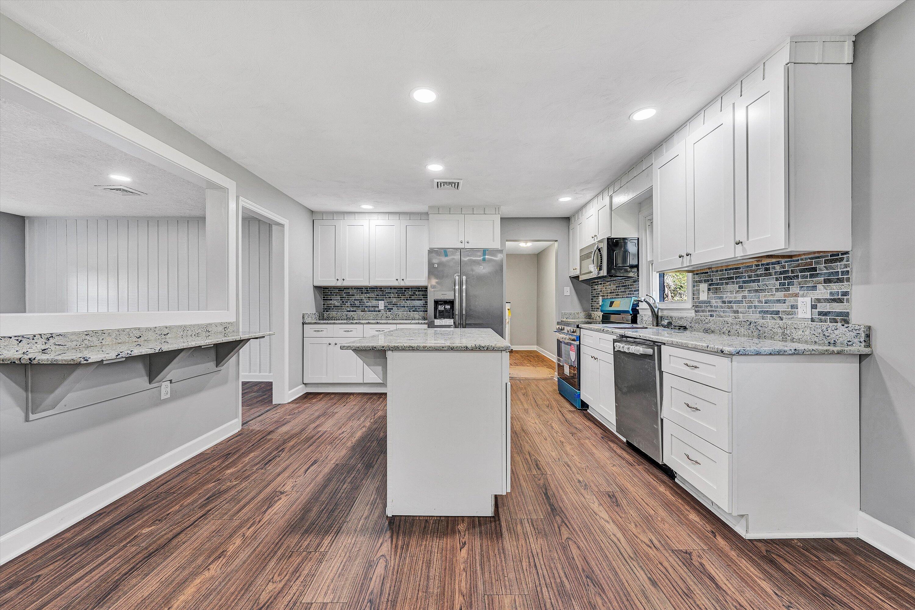 304 Broken Arrow Lane Covington, VA 24426 - Photo 15 of 46 a kitchen with a white cabinets stove top oven and refrigerator