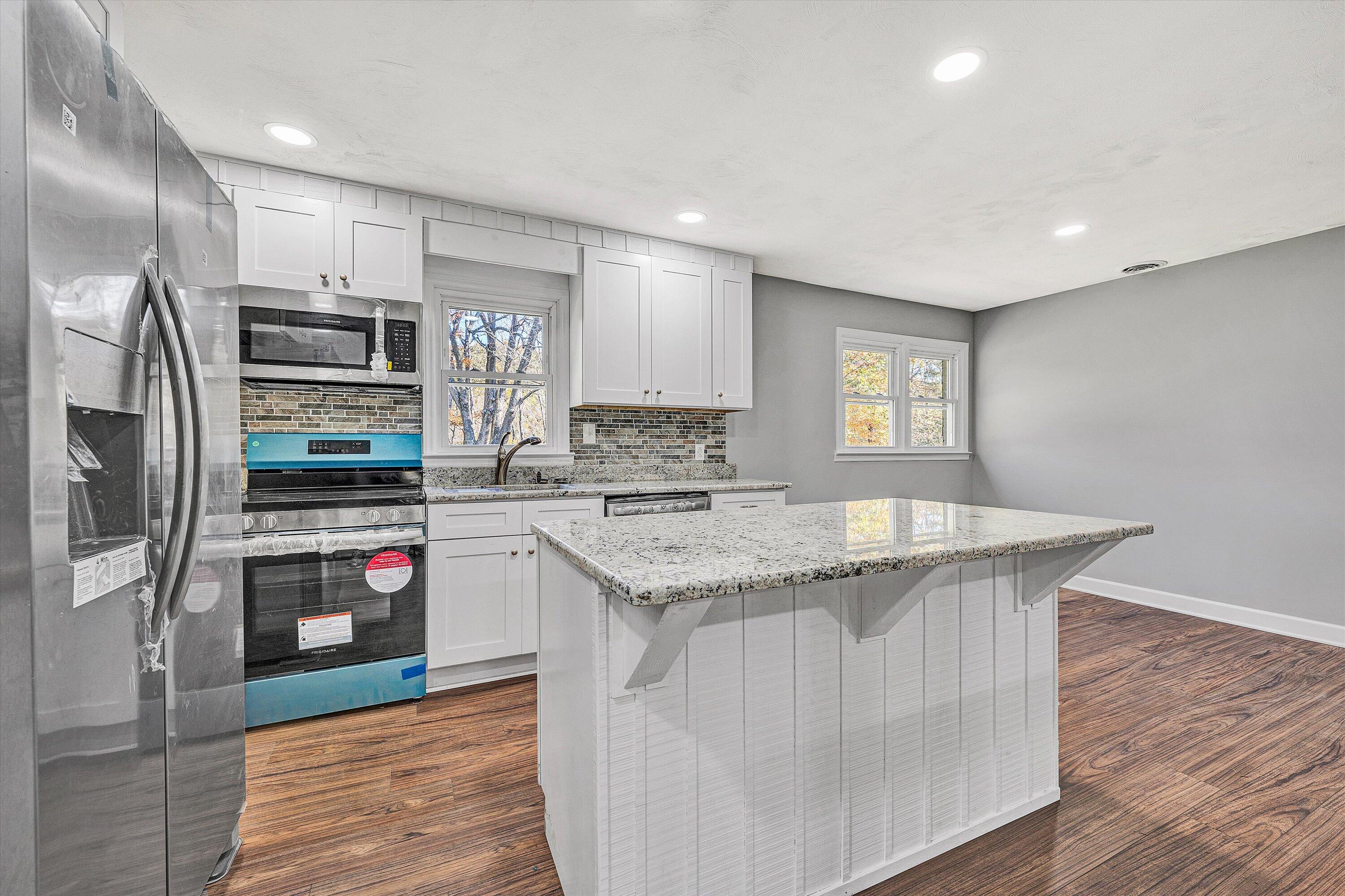 304 Broken Arrow Lane Covington, VA 24426 - Photo 17 of 46 a kitchen with stainless steel appliances granite countertop a refrigerator and a stove