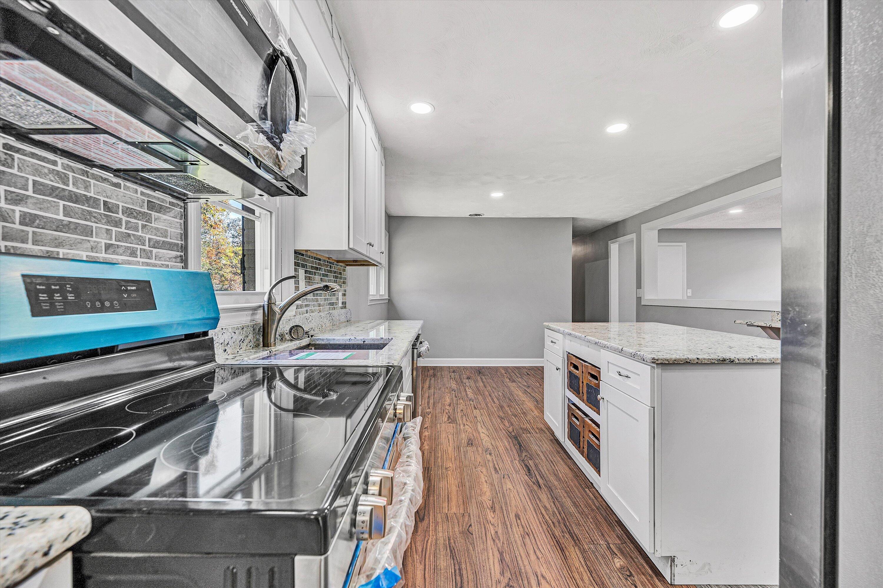 304 Broken Arrow Lane Covington, VA 24426 - Photo 19 of 46 a kitchen with a stove and a sink