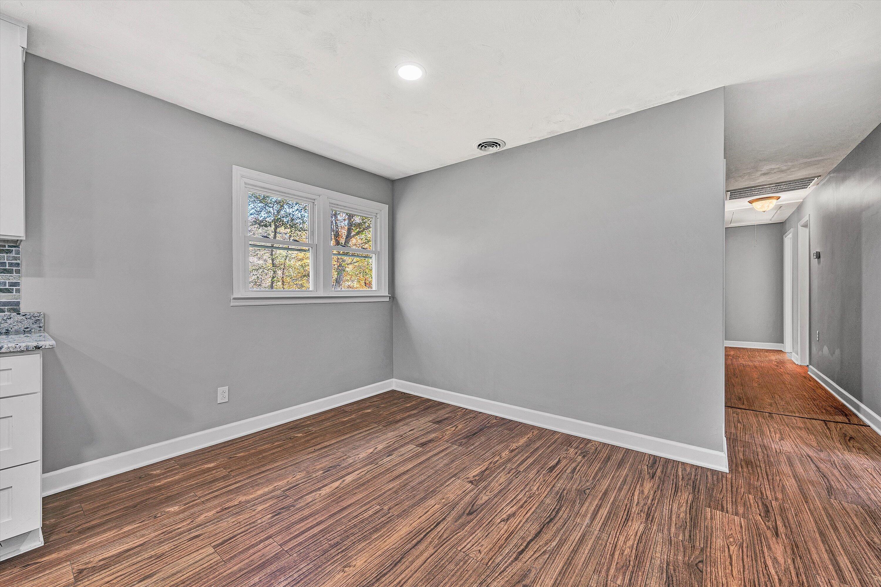 304 Broken Arrow Lane Covington, VA 24426 - Photo 20 of 46 a view of room with wooden floor and window