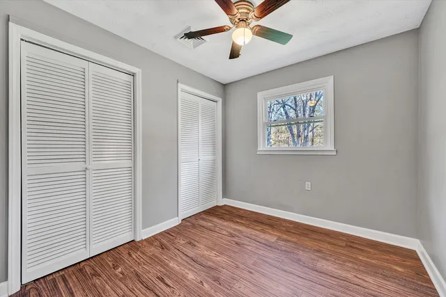 a bathroom with a sink toilet and mirror